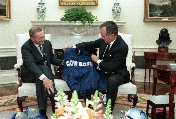 Jerry Jones presents President Bush with Cowboys jacket