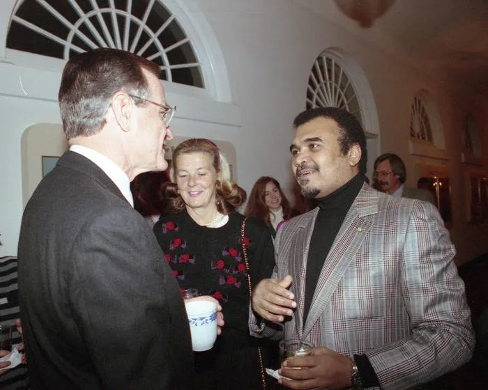 President Bush visits with Prince Bandar at a private reception and movie in the family theater