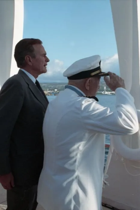 President Bush stands at attention as USS Nevada survivor and Medal of Honor recipient, Captain Donald K. Ross (USN Retired)