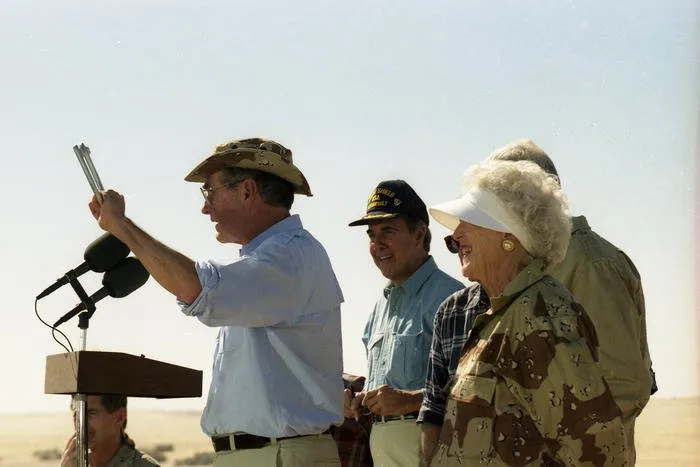 President and Mrs. Bush visit troops from the U.S. Army’s 197th Brigade in Saudi Arabia, and have Thanksgiving Dinner with them