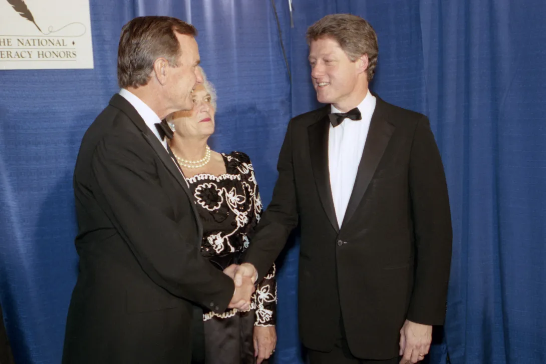 President Elect and Mrs. Bush greet Arkansas Governor Bill Clinton at a Literacy dinner sponsored by ABC, PBS, and Prudential and hosted by Peter Jennings to honor seventeen "Learners of the Month."