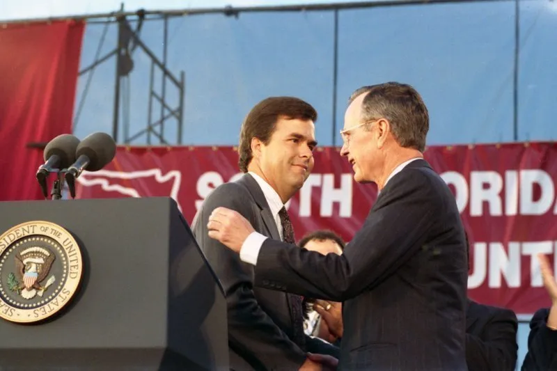 President Bush addresses a Bush-Quayle fundraising dinner and is introduced by Jeb