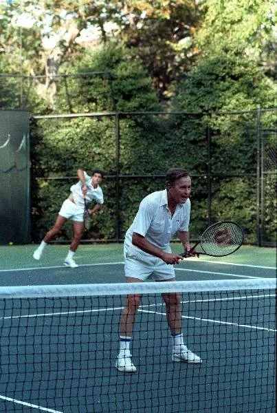 President Bush playing tennis with Pete Sampras