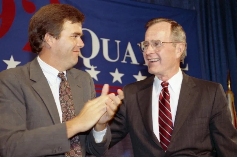 President Bush addresses a Bush-Quayle fundraising dinner where dias participants include Jeb Bush