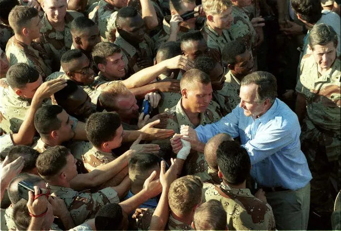 President Bush greets troops during his Thanksgiving visit to Saudi Arabia