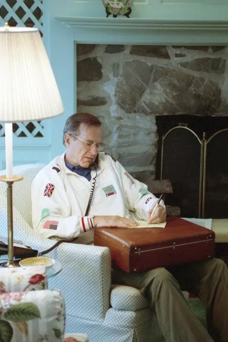 President Bush speaks to Amir Khalifa Bin Hamad of Qatar, from his living room in Kennebunkport, Maine, regarding Iraq’s invasion of Kuwait