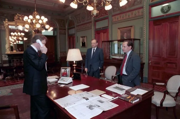 Vice President Quayle works in his office with staff, including William Kristol, Chief of Staff