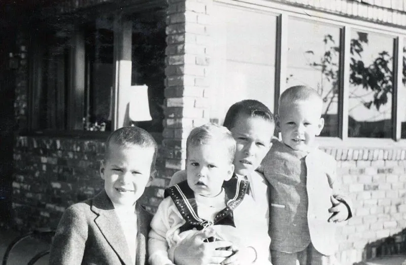 Jeb, George W. holding Marvin, and Neil Bush