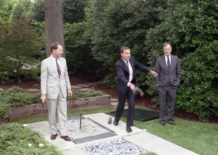 President Bush pitches horseshoes with Shuttle Discovery astronauts