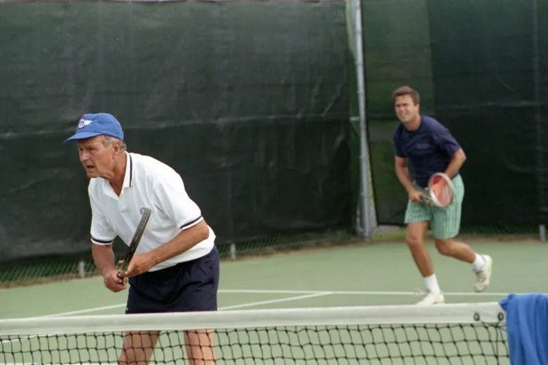 President Bush plays tennis at Walker's Point with Jeb