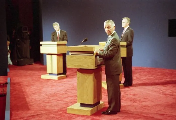 President Bush participates in the third and final Presidential Debate between himself, Governor Bill Clinton, and Ross Perot in East Lansing, Michigan