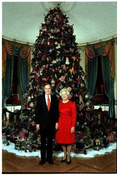 President Bush and Barbara Bush in front of White House Tree