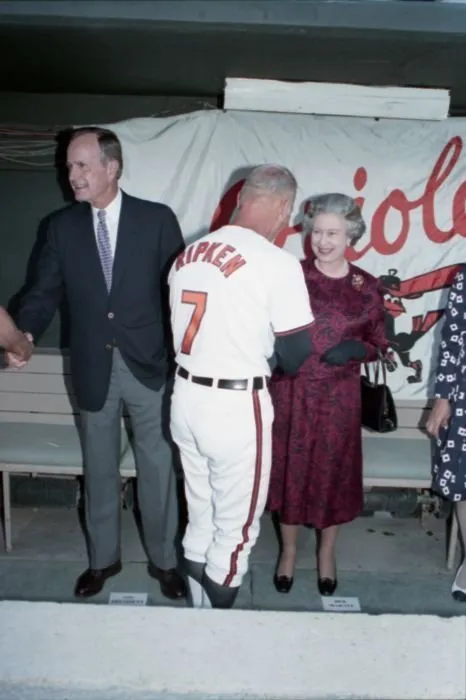 President Bush and Queen Elizabeth II greet Cal Ripken, Sr. in Baltimore Orioles dugout
