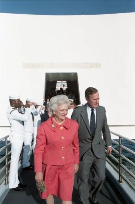 President and Mrs. Bush exit the USS Arizona Memorial after attending ceremonies commemorating the 50th anniversary of the Japanese attack on Pearl Harbor.