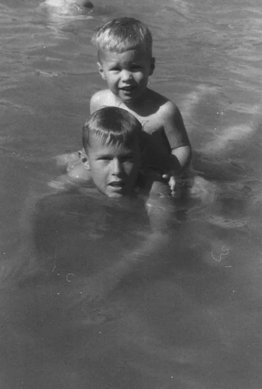 George W. Bush swimming with Jeb on his back