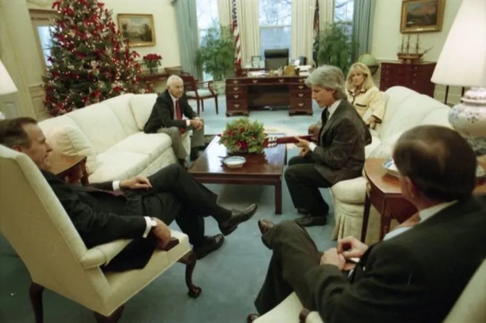 President Bush and Will Farish visit with Johnny Carson and his family in the Oval Office