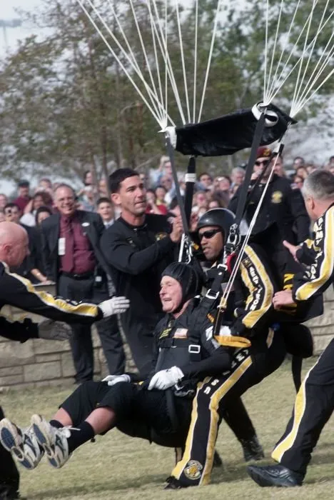 George Bush Completes Parachute Jump for 10th Anniversary of Library