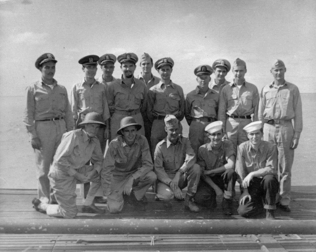 Aviators and crewmen rescued by the USS Finback during the first phase of Operation Stalemate II pose for a photo with officers of the USS Finback